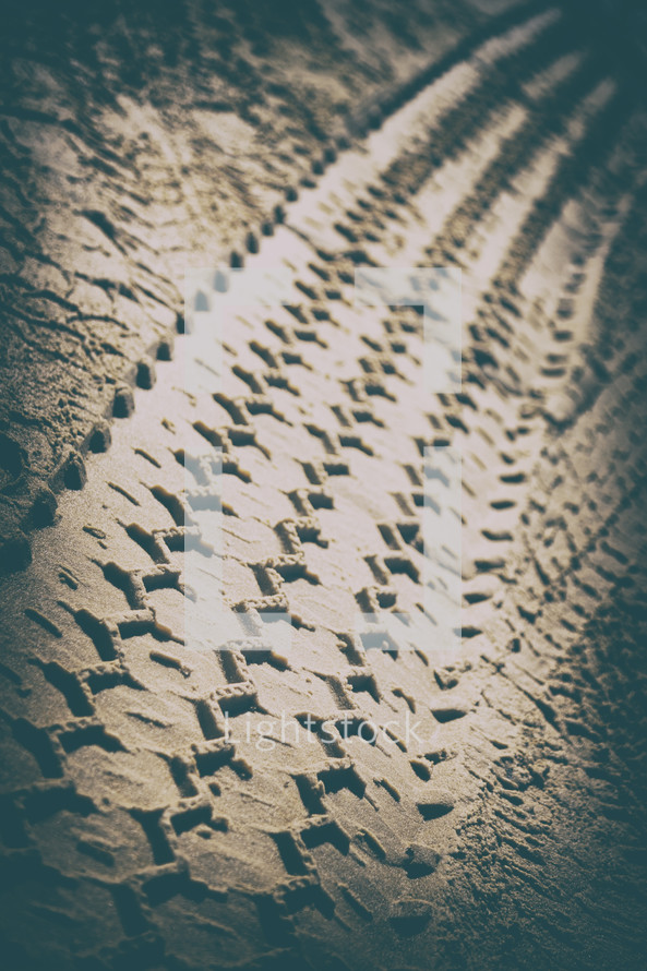 tire tracks in the sand 