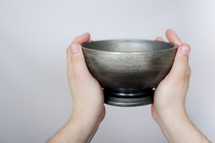 hand holding up a bowl
