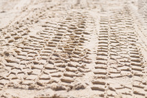 tire tracks in the sand 
