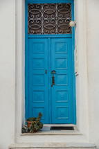 blue door on a home in Greece 