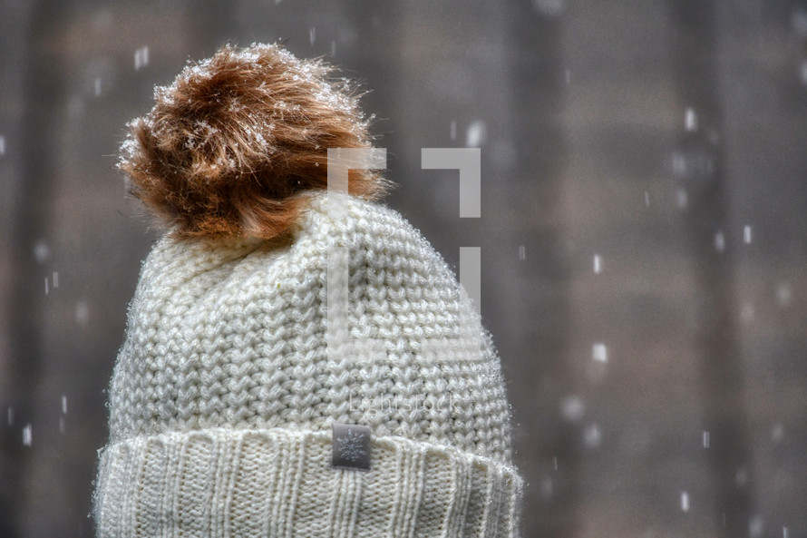 beanie in falling snow 