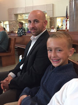 father and son sitting in church 