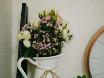 flowers in a white pitcher 