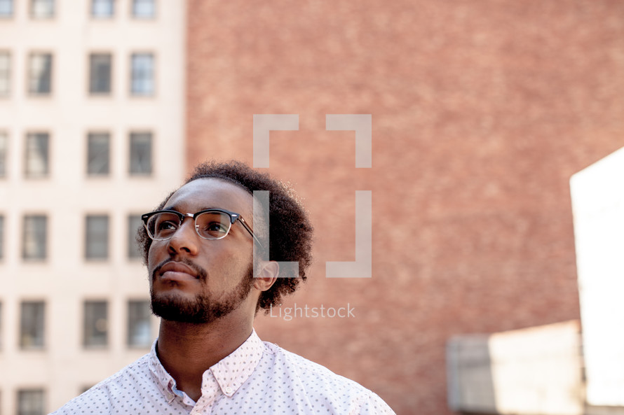 An African American man looking out 