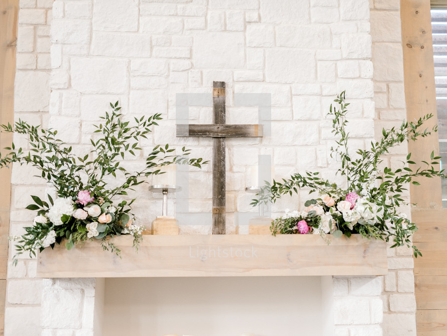 cross and flowers on an altar 