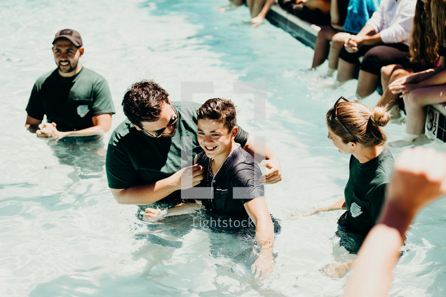 teen being baptized 