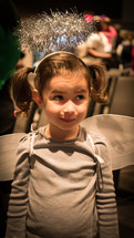 little girl in an angel costume 
