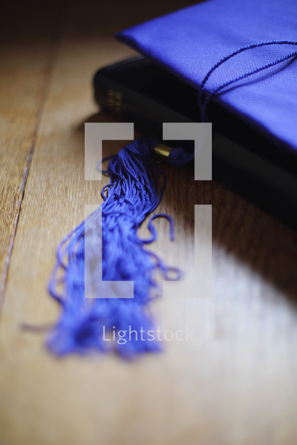 a vertical shot of mortar board on Bible
