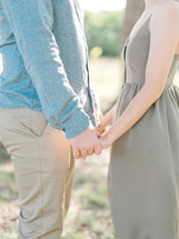 couple holding hands 