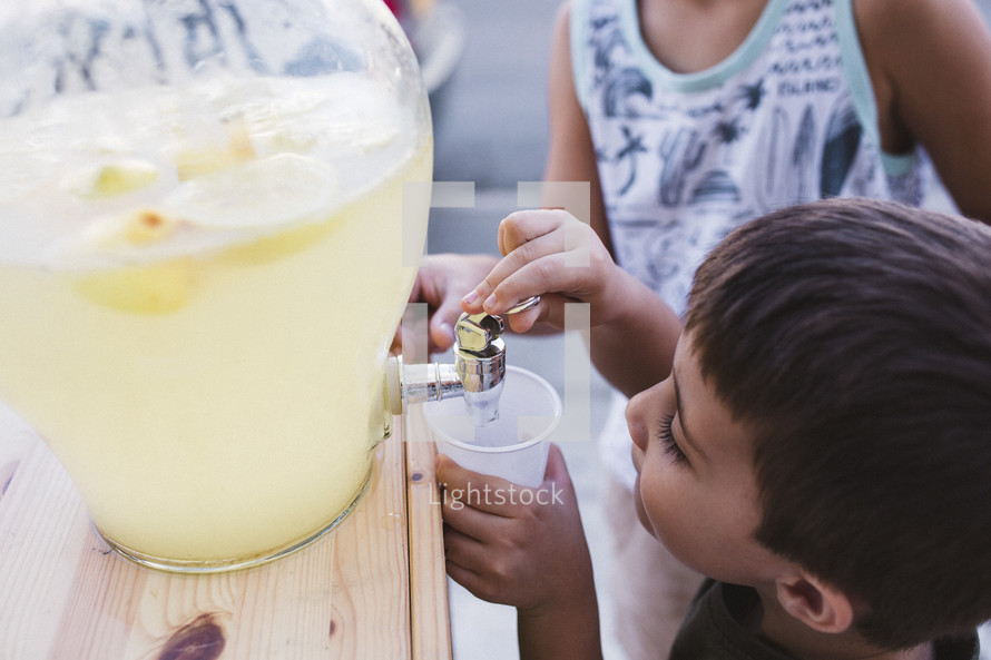 child at a lemonade stand 