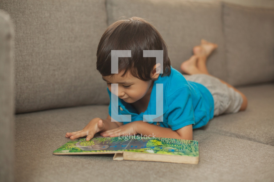 toddler reading a book 