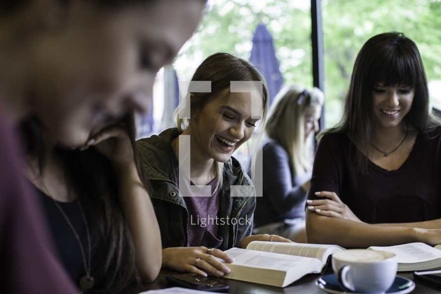 women reading Bibles at a Bible study 
