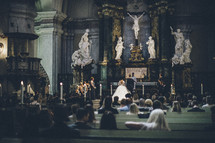 bride and groom exchanging  vows in a cathedral 