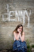Jenny - crouched woman with her hands on her face