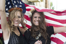 teens girls draped in an American flag 
