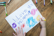 child coloring a picture - i love you mommy