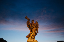Angel statue holding a cross