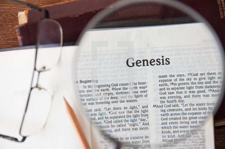 magnifying glass over Genesis 