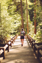 a woman hiking a trail 