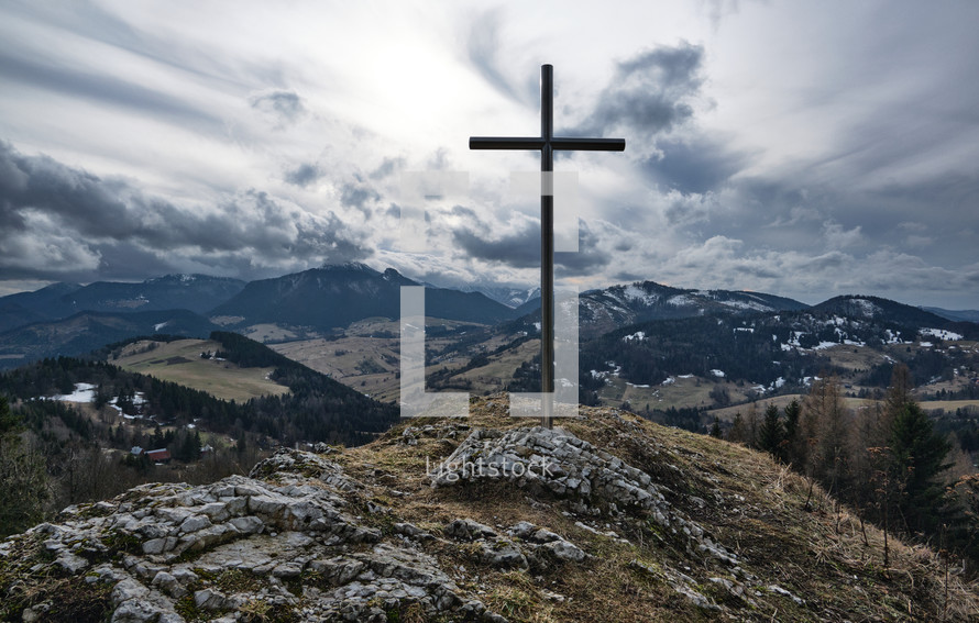 Winter nature panorama, steel cross with religious christian background