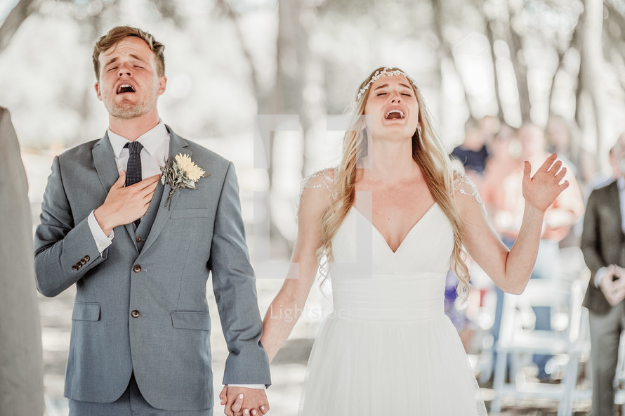 bride and groom singing praises to God 