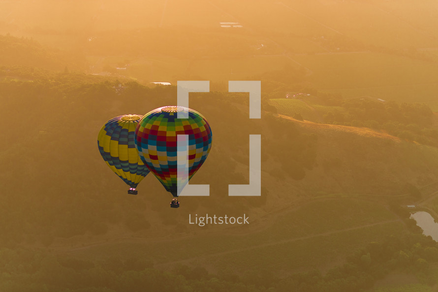 hot air balloons in the sky at sunset 