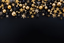 Christmas background with golden and black baubles and stars on black