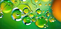 Close-up of colorful water drops on a green background. Macro