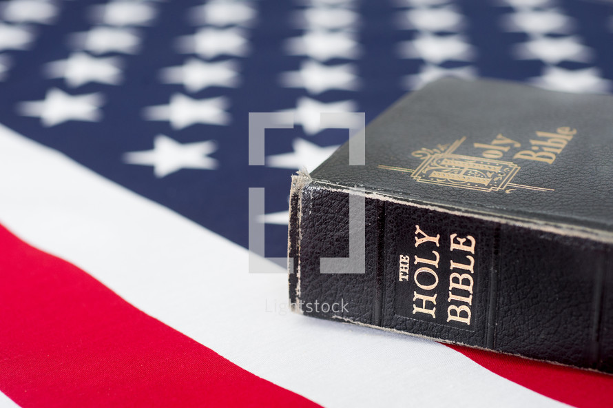 Holy Bible on an American flag.