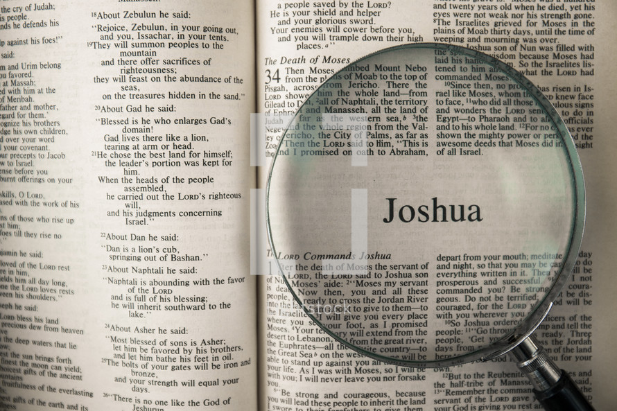 magnifying glass over Bible - Joshua 