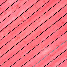 Close-up of a red wooden fence.