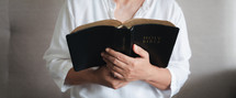 Woman holding a Bible