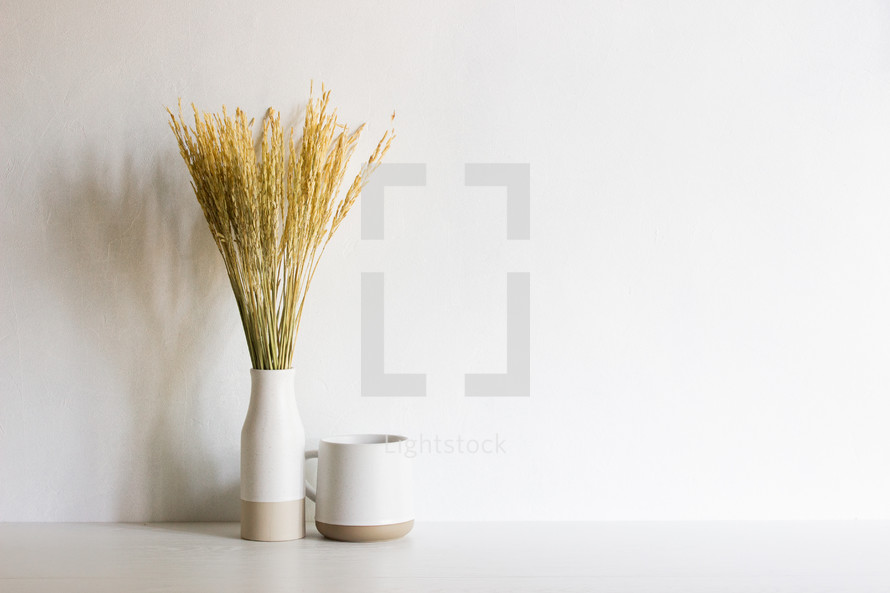 wheat in a vase and coffee cup 