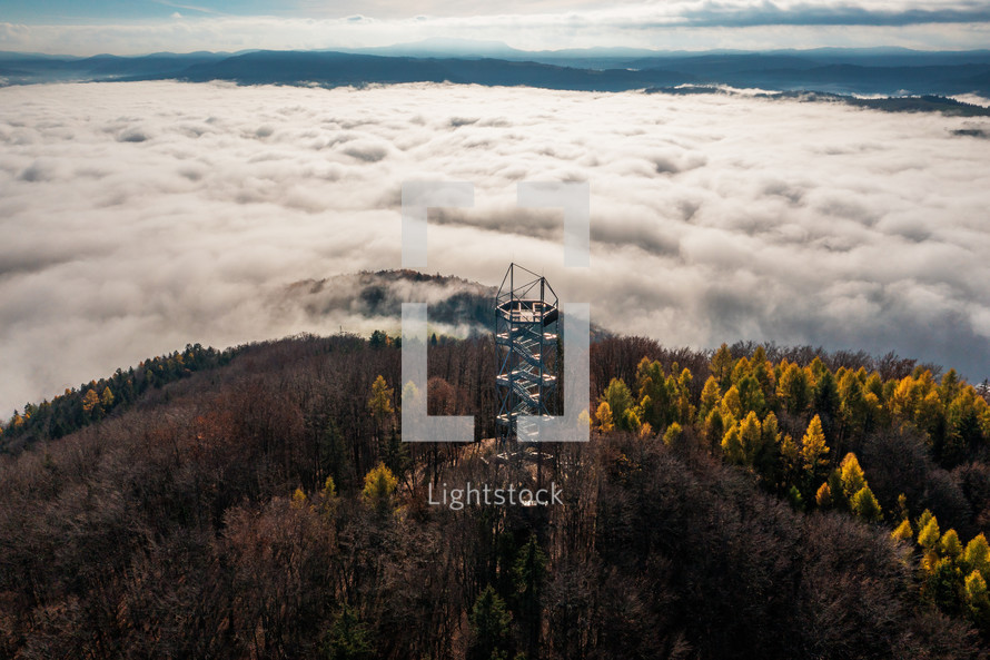 Aerial Drone Shot: Sightseeing Tower in Brezno, Autumn Scenery with Misty Morning and Cloud Inversion in Horehronie Region