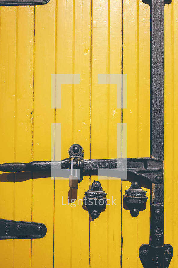 locked yellow wooden door 