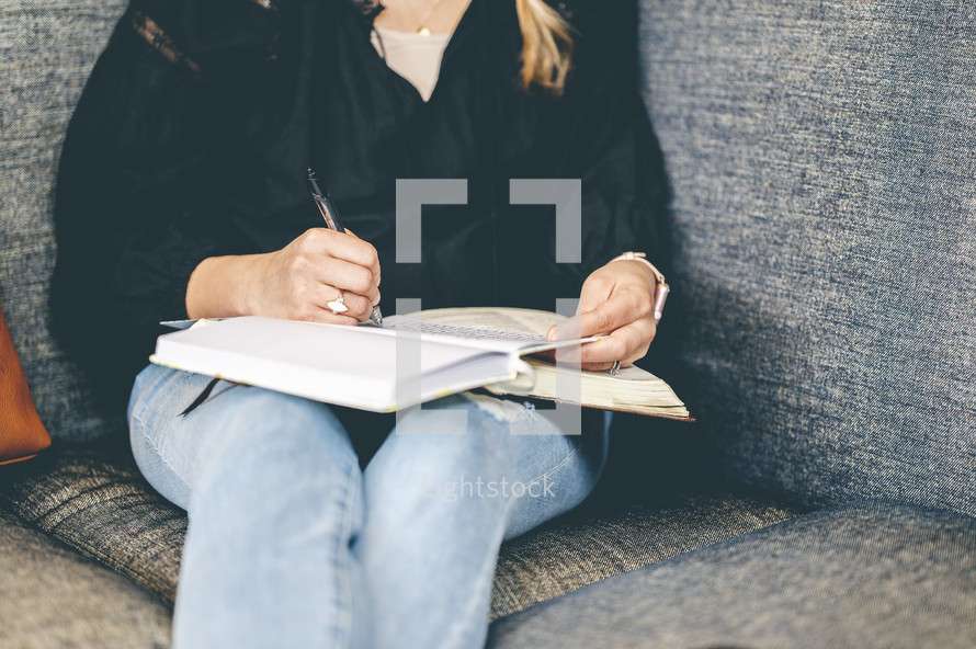 a woman journaling and reading a Bible 