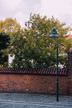 brick wall and cobblestone street in Copenhagen 