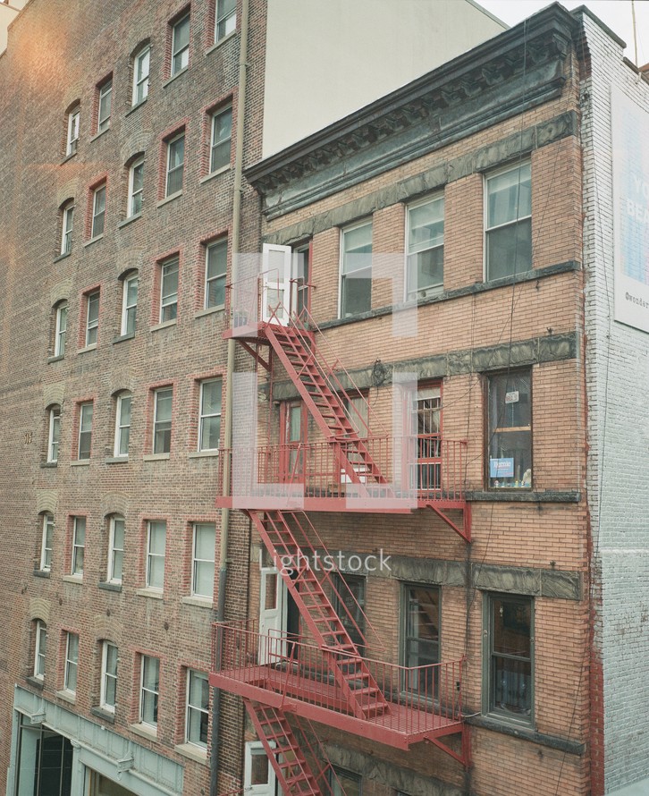 fire escape steps on a brick apartment building 