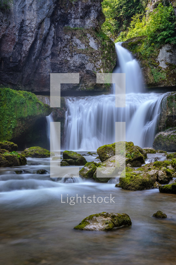 waterfall over a rock cliff 