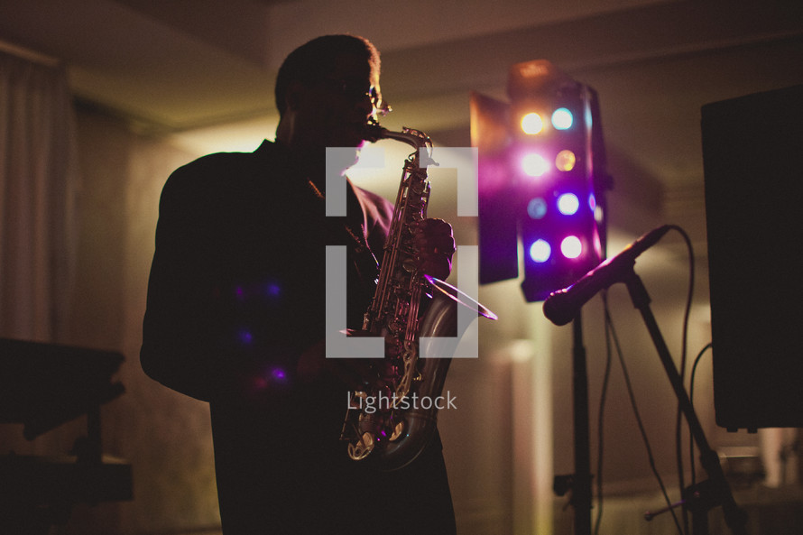 man playing a saxophone 