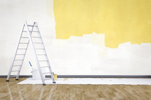 ladder, tarp, wood floor, paint buckets, paint, wall, paint brushes, renovations, home improvements
