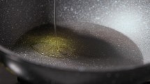 Pouring Oil On a Non-stick Pan. - close up shot