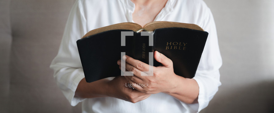 Woman holding a Bible