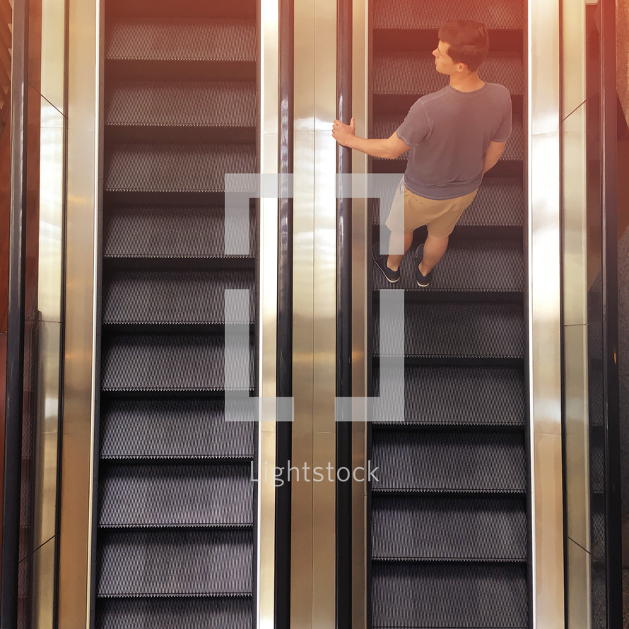 a man on an escalator 