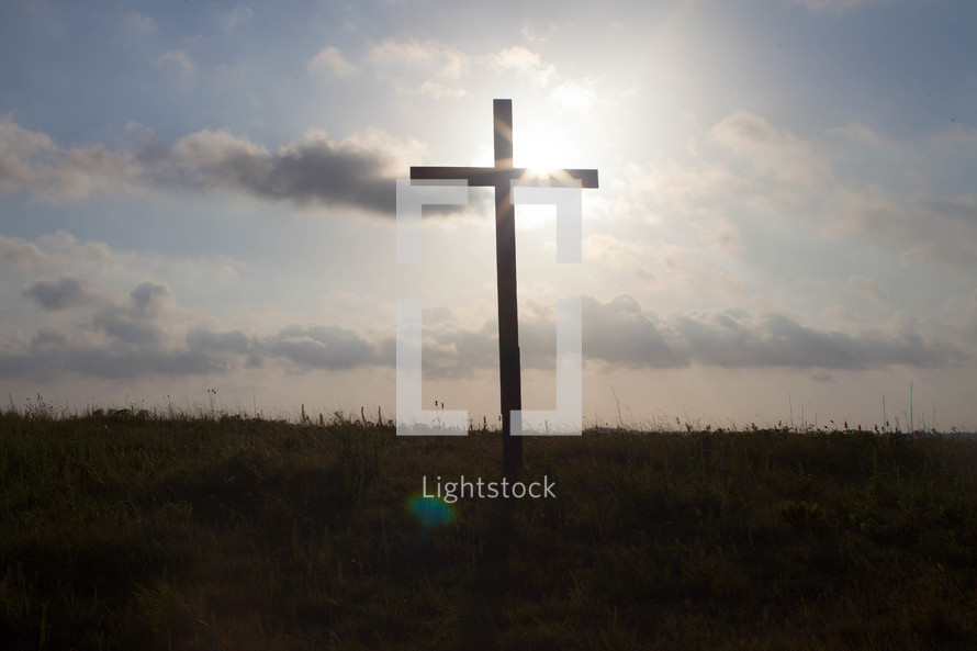 sunburst behind a cross