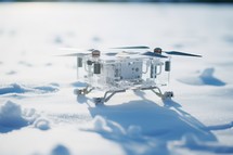 Miniature model of a drone in the snow. Close-up.