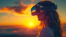 Young woman wearing virtual reality goggles on the beach at sunset. Future technology concept