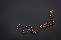 rosary on a black background 