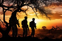 Silhouette of soldiers in the jungle at sunset