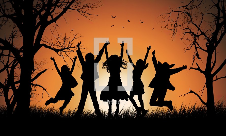 Silhouette of happy children jumping in the autumn forest at sunset